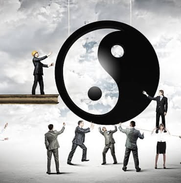 Group of businesspeople and yin yang sign