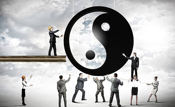 Group of businesspeople and yin yang sign