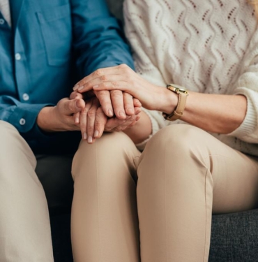 stock-photo-cropped-view-husband-wife-holding