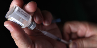 A nurse prepares a H1N1 influenza vaccine during the start of a campaign against the influenza at a hospital in Tegucigalpa
